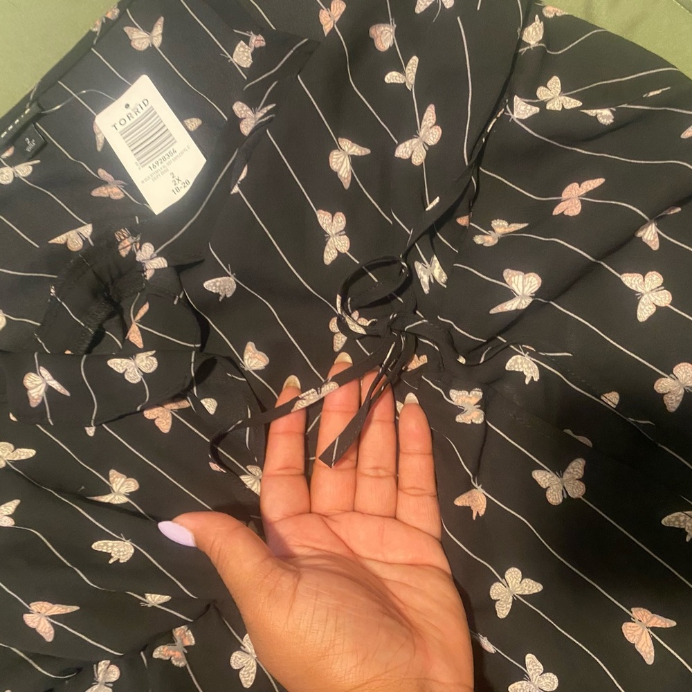 New with tags, black butterfly, print Torrid faux wrap top. - Picture 3 of 4